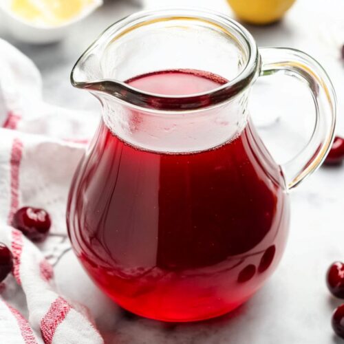 Pouring-Cherry-Tea-into-Pitcher